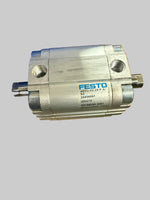 Metal component with Festo branding on a cardboard box